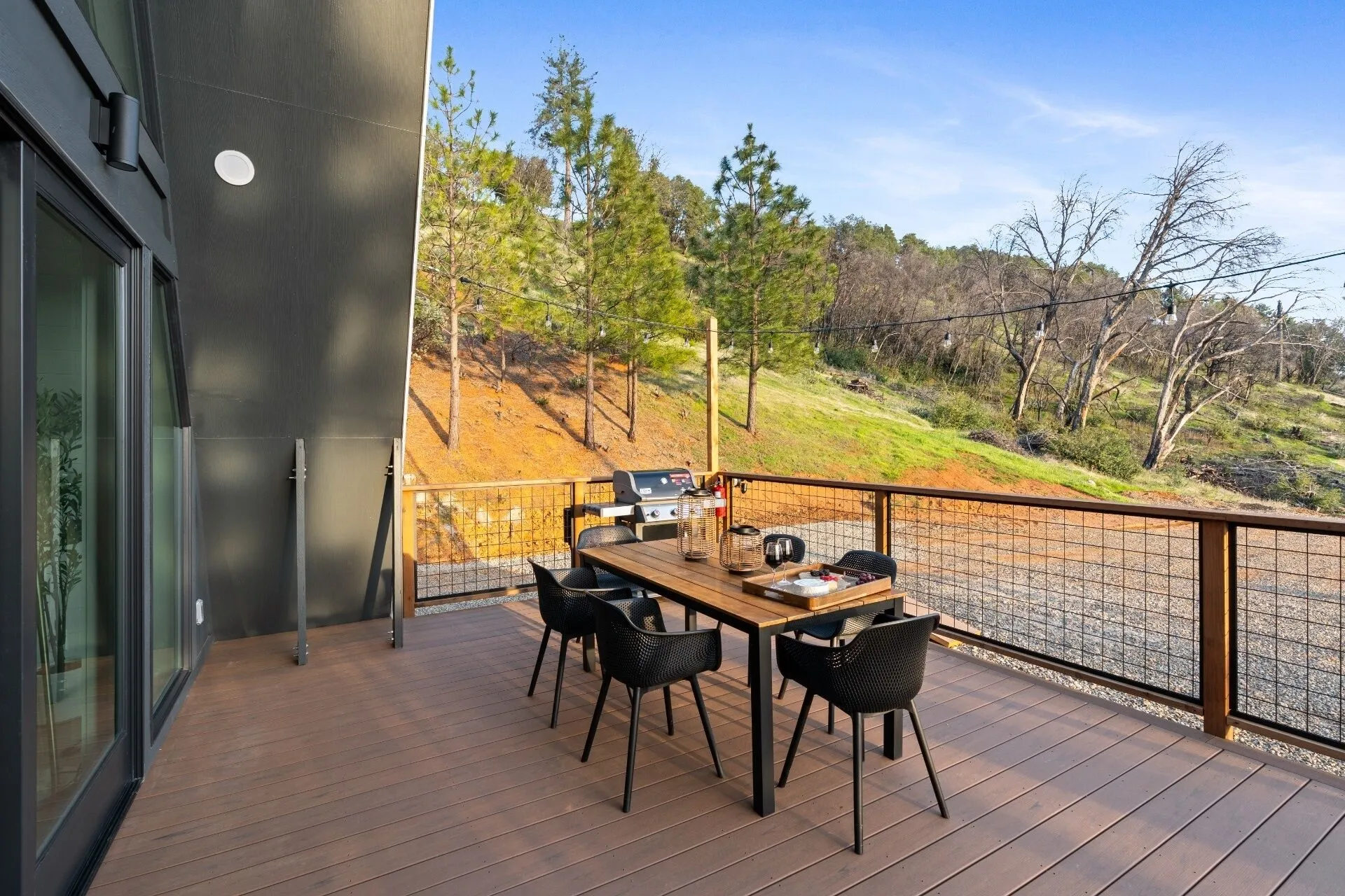View of the forested Sierra foothills from the deck